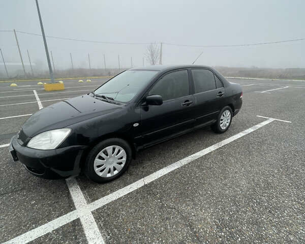 Черный Мицубиси Лансер, объемом двигателя 1.58 л и пробегом 214 тыс. км за 4400 $, фото 6 на Automoto.ua