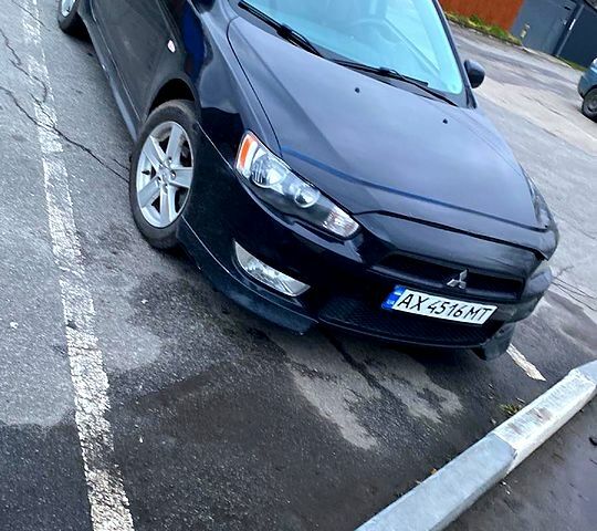 Черный Мицубиси Лансер, объемом двигателя 2 л и пробегом 156 тыс. км за 7100 $, фото 1 на Automoto.ua