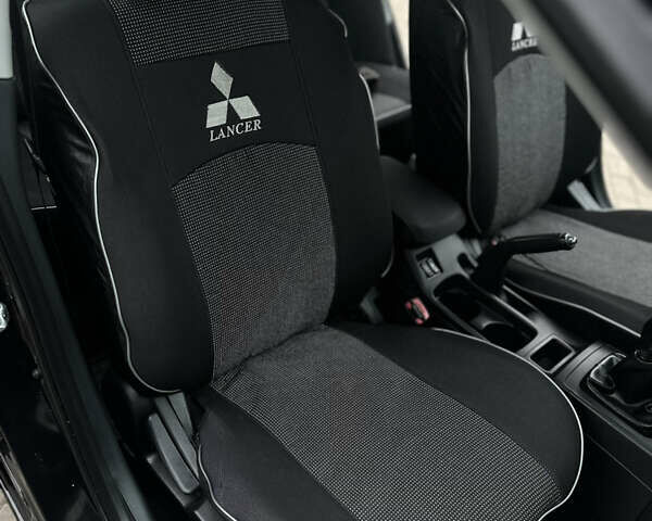 Чорний Міцубісі Lancer, об'ємом двигуна 1.5 л та пробігом 111 тис. км за 6999 $, фото 58 на Automoto.ua