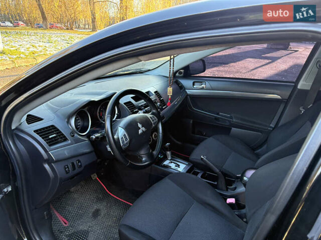 Черный Мицубиси Лансер, объемом двигателя 2 л и пробегом 236 тыс. км за 6450 $, фото 8 на Automoto.ua