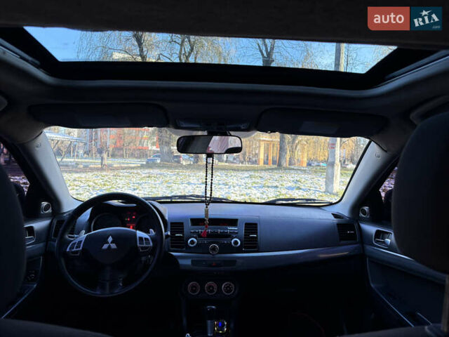 Черный Мицубиси Лансер, объемом двигателя 2 л и пробегом 236 тыс. км за 6450 $, фото 6 на Automoto.ua