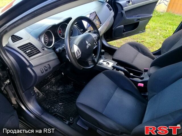 Черный Мицубиси Лансер, объемом двигателя 2 л и пробегом 196 тыс. км за 5500 $, фото 12 на Automoto.ua