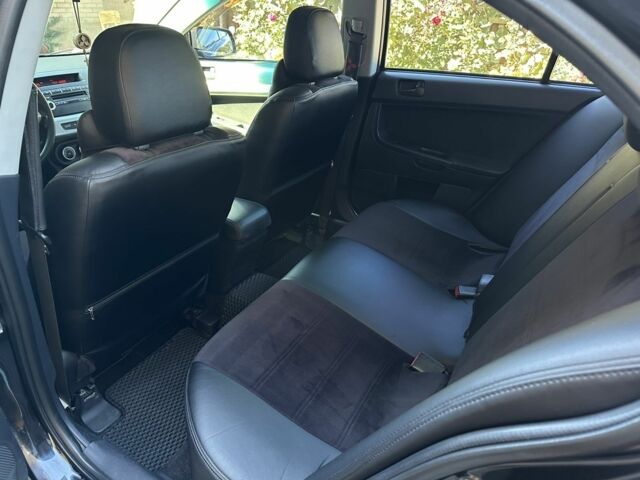 Чорний Міцубісі Lancer, об'ємом двигуна 2 л та пробігом 230 тис. км за 6650 $, фото 13 на Automoto.ua