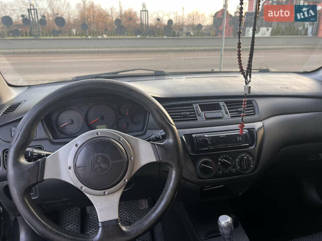 Черный Мицубиси Лансер, объемом двигателя 1.6 л и пробегом 245 тыс. км за 4300 $, фото 8 на Automoto.ua