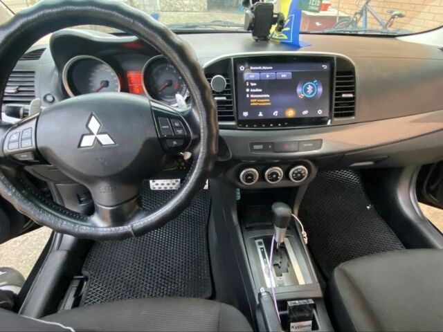 Черный Мицубиси Лансер, объемом двигателя 2 л и пробегом 140 тыс. км за 7200 $, фото 7 на Automoto.ua