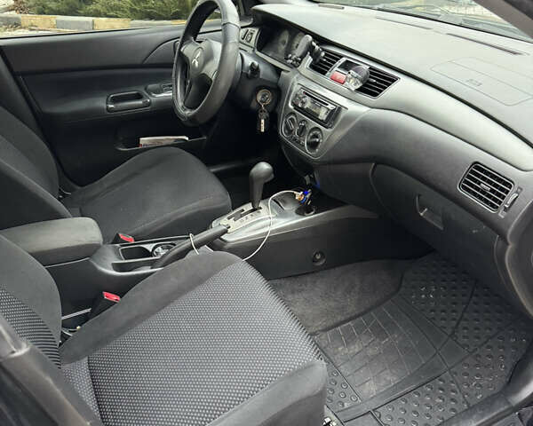 Черный Мицубиси Лансер, объемом двигателя 1.6 л и пробегом 240 тыс. км за 5200 $, фото 2 на Automoto.ua