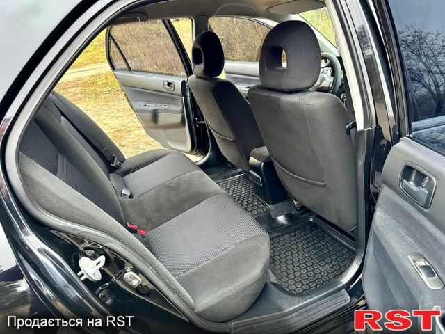 Черный Мицубиси Лансер, объемом двигателя 1.6 л и пробегом 216 тыс. км за 5190 $, фото 10 на Automoto.ua