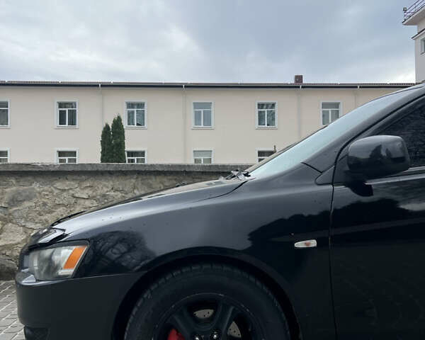 Черный Мицубиси Лансер, объемом двигателя 2 л и пробегом 165 тыс. км за 6900 $, фото 6 на Automoto.ua