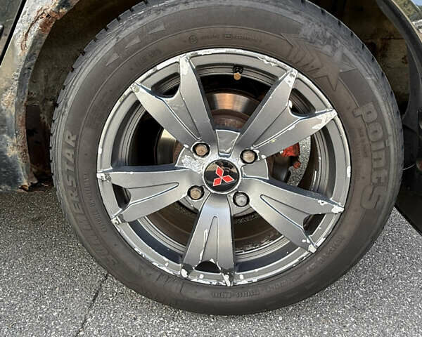 Черный Мицубиси Лансер, объемом двигателя 1.6 л и пробегом 321 тыс. км за 5000 $, фото 20 на Automoto.ua