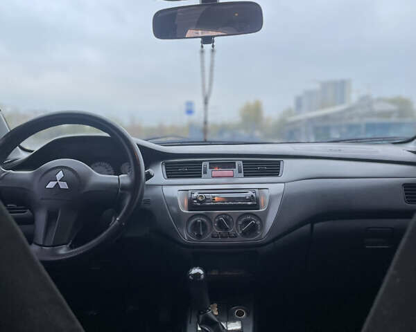 Міцубісі Lancer 2008 у Києві на Automoto.ua Чорний Міцубісі Lancer, об'ємом двигуна 1.58 л та пробігом 300 тис. км за 3800 $, фото 6 на Automoto.ua