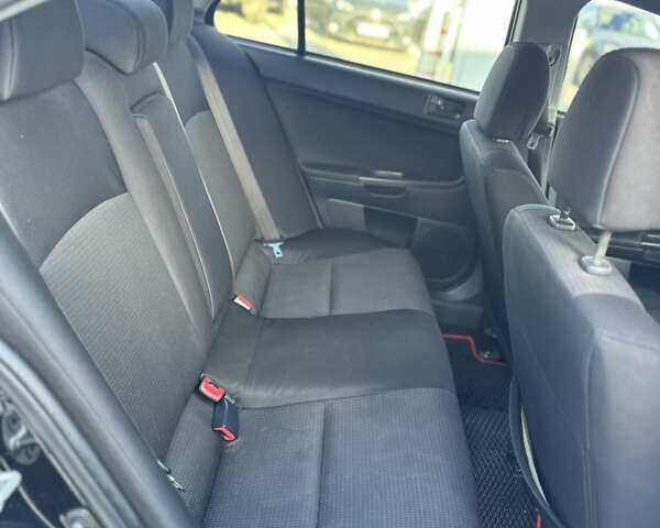 Чорний Міцубісі Lancer, об'ємом двигуна 2 л та пробігом 290 тис. км за 5900 $, фото 26 на Automoto.ua