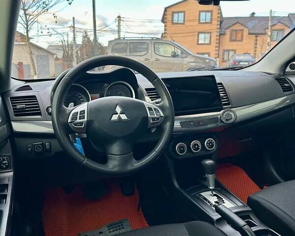 Черный Мицубиси Лансер, объемом двигателя 2 л и пробегом 150 тыс. км за 7850 $, фото 36 на Automoto.ua