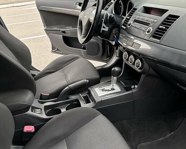 Чорний Міцубісі Lancer, об'ємом двигуна 2 л та пробігом 199 тис. км за 7900 $, фото 48 на Automoto.ua