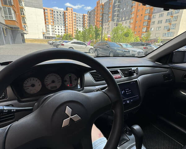 Черный Мицубиси Лансер, объемом двигателя 1.58 л и пробегом 163 тыс. км за 5699 $, фото 10 на Automoto.ua