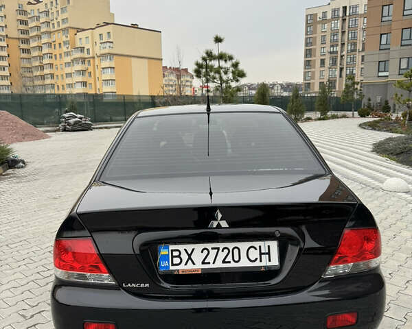 Черный Мицубиси Лансер, объемом двигателя 1.6 л и пробегом 240 тыс. км за 5200 $, фото 7 на Automoto.ua