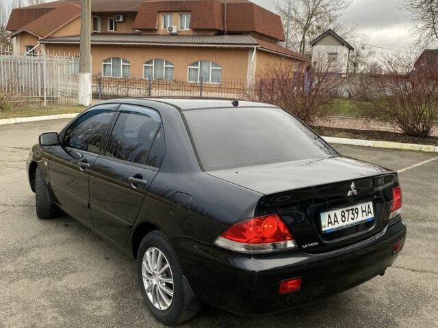Черный Мицубиси Лансер, объемом двигателя 1.6 л и пробегом 350 тыс. км за 4500 $, фото 1 на Automoto.ua