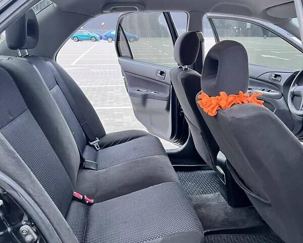 Чорний Міцубісі Lancer, об'ємом двигуна 1.6 л та пробігом 300 тис. км за 5500 $, фото 6 на Automoto.ua