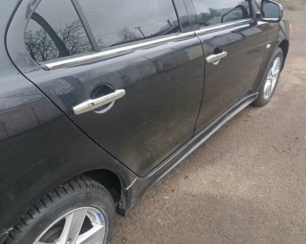 Черный Мицубиси Лансер, объемом двигателя 2 л и пробегом 192 тыс. км за 6350 $, фото 9 на Automoto.ua