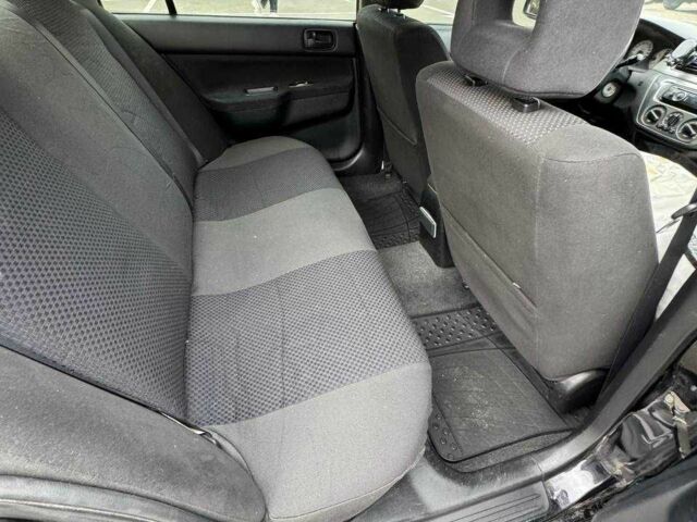 Чорний Міцубісі Lancer, об'ємом двигуна 1.6 л та пробігом 245 тис. км за 4500 $, фото 19 на Automoto.ua