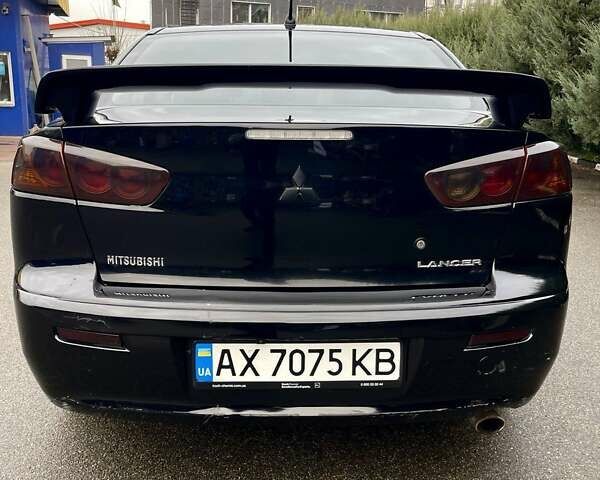 Чорний Міцубісі Lancer, об'ємом двигуна 2 л та пробігом 217 тис. км за 5800 $, фото 8 на Automoto.ua