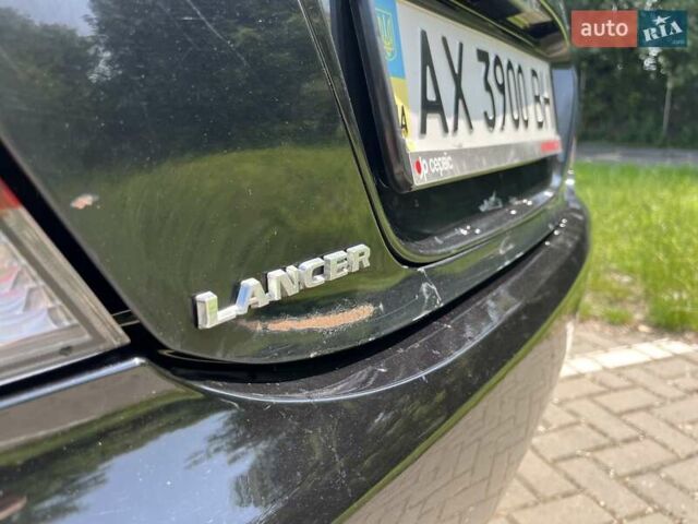 Чорний Міцубісі Lancer, об'ємом двигуна 1.6 л та пробігом 296 тис. км за 4200 $, фото 23 на Automoto.ua