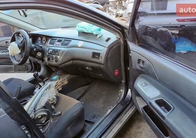 Черный Мицубиси Лансер, объемом двигателя 1.6 л и пробегом 200 тыс. км за 2000 $, фото 6 на Automoto.ua