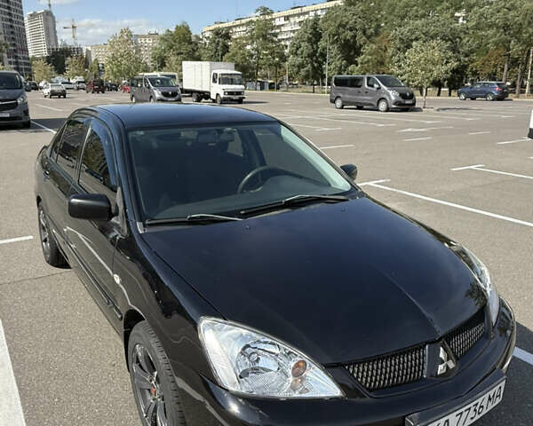 Черный Мицубиси Лансер, объемом двигателя 1.6 л и пробегом 321 тыс. км за 5000 $, фото 5 на Automoto.ua