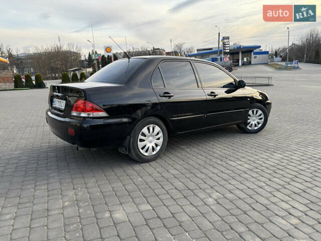 Чорний Міцубісі Lancer, об'ємом двигуна 1.58 л та пробігом 344 тис. км за 3999 $, фото 1 на Automoto.ua