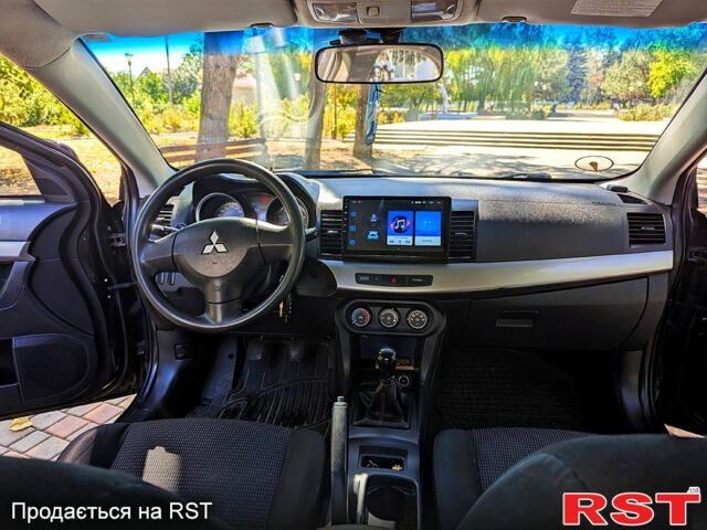 Черный Мицубиси Лансер, объемом двигателя 1.5 л и пробегом 235 тыс. км за 5250 $, фото 9 на Automoto.ua