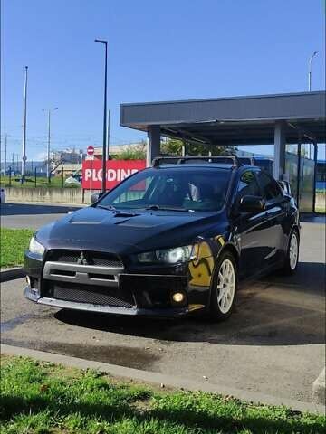 Чорний Міцубісі Lancer, об'ємом двигуна 2 л та пробігом 134 тис. км за 29034 $, фото 7 на Automoto.ua