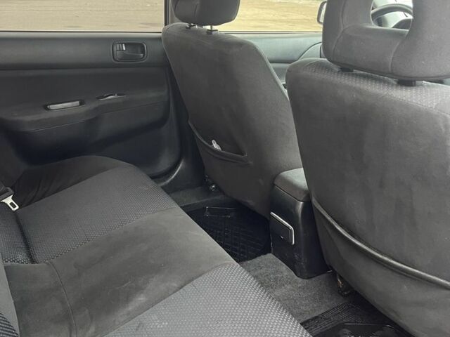 Черный Мицубиси Лансер, объемом двигателя 1.6 л и пробегом 1 тыс. км за 3750 $, фото 5 на Automoto.ua