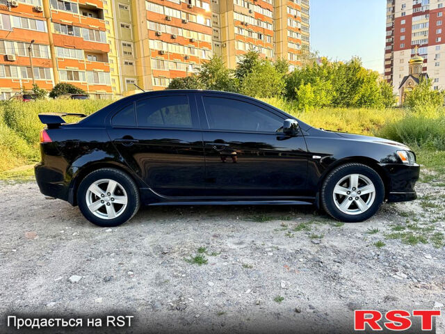 Черный Мицубиси Лансер, объемом двигателя 2 л и пробегом 157 тыс. км за 7690 $, фото 6 на Automoto.ua