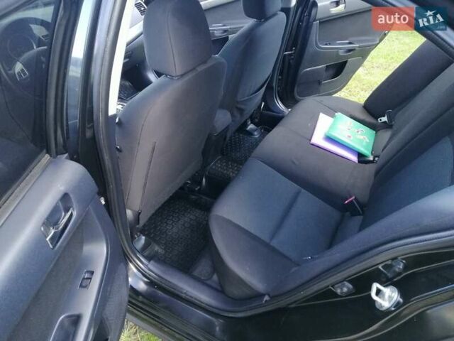 Мицубиси Лансер 2008 в Киеве на Automoto.ua Черный Мицубиси Лансер, объемом двигателя 2 л и пробегом 196 тыс. км за 5500 $, фото 21 на Automoto.ua