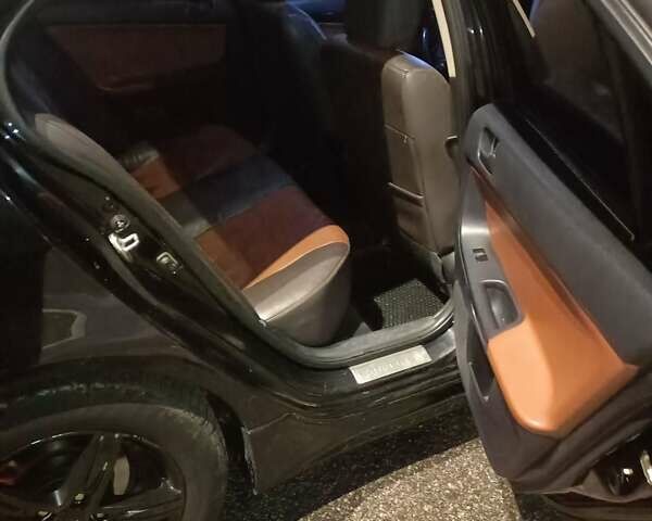 Черный Мицубиси Лансер, объемом двигателя 2 л и пробегом 240 тыс. км за 6400 $, фото 12 на Automoto.ua