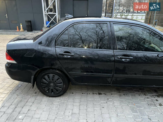 Чорний Міцубісі Lancer, об'ємом двигуна 1.6 л та пробігом 277 тис. км за 3900 $, фото 16 на Automoto.ua
