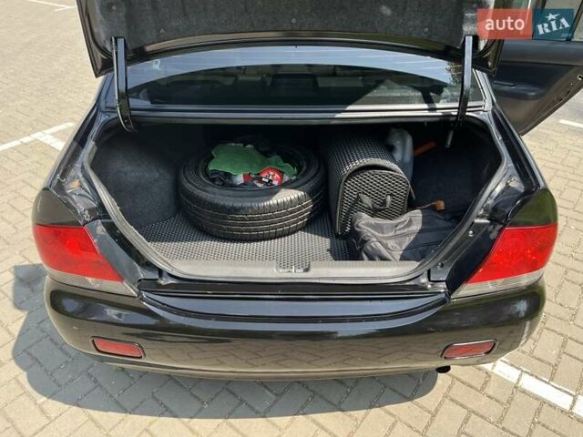 Чорний Міцубісі Lancer, об'ємом двигуна 1.6 л та пробігом 296 тис. км за 4200 $, фото 49 на Automoto.ua