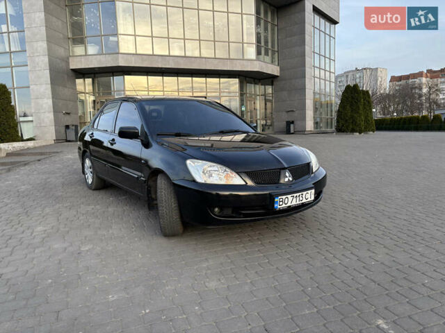 Чорний Міцубісі Lancer, об'ємом двигуна 1.58 л та пробігом 344 тис. км за 3999 $, фото 2 на Automoto.ua