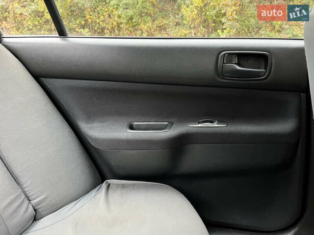 Чорний Міцубісі Lancer, об'ємом двигуна 1.58 л та пробігом 192 тис. км за 4500 $, фото 16 на Automoto.ua