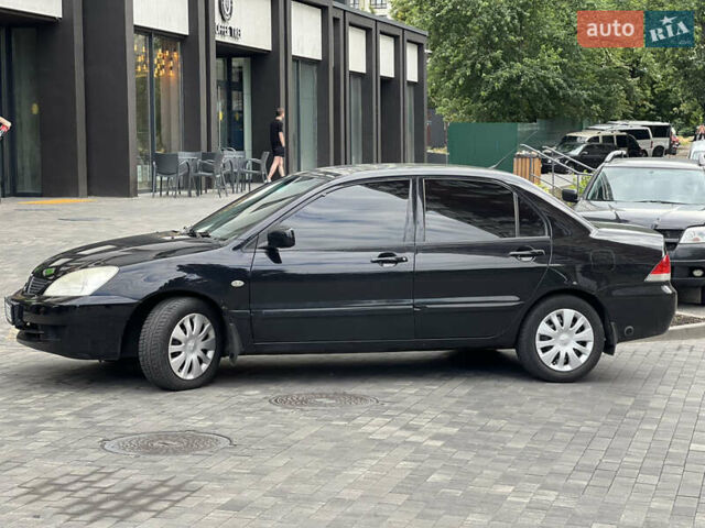 Черный Мицубиси Лансер, объемом двигателя 1.6 л и пробегом 167 тыс. км за 4850 $, фото 4 на Automoto.ua