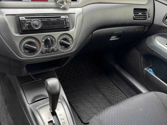 Чорний Міцубісі Lancer, об'ємом двигуна 1.6 л та пробігом 245 тис. км за 4500 $, фото 16 на Automoto.ua