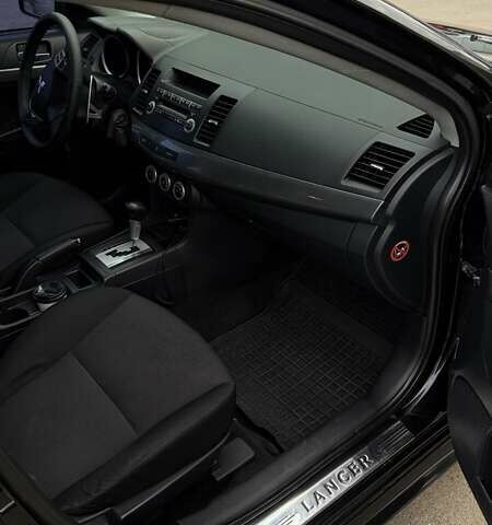 Черный Мицубиси Лансер, объемом двигателя 2 л и пробегом 222 тыс. км за 6000 $, фото 2 на Automoto.ua