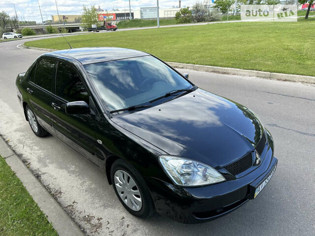 Чорний Міцубісі Lancer, об'ємом двигуна 1.6 л та пробігом 103 тис. км за 4300 $, фото 7 на Automoto.ua