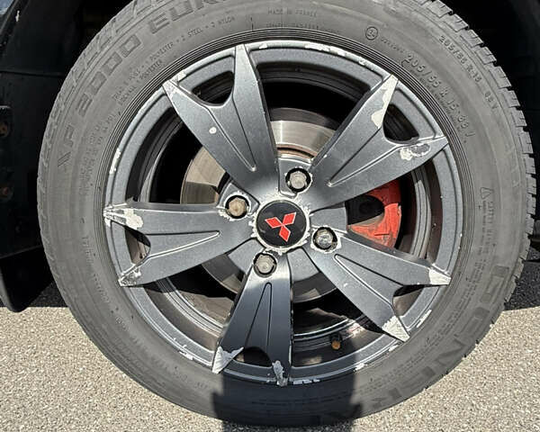 Черный Мицубиси Лансер, объемом двигателя 1.6 л и пробегом 321 тыс. км за 5000 $, фото 18 на Automoto.ua