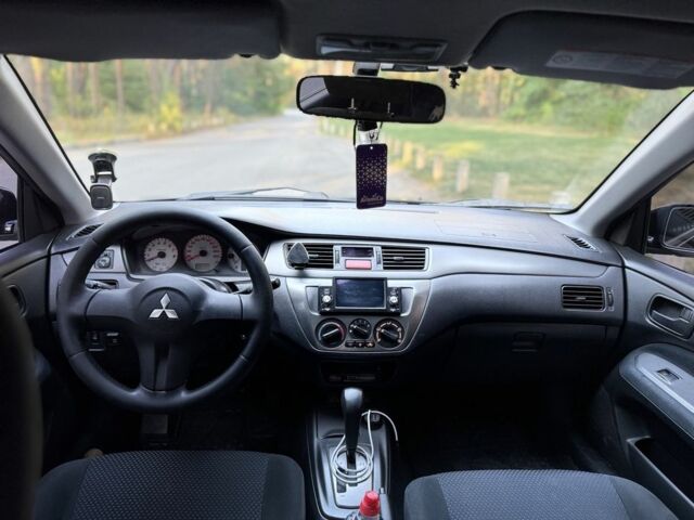 Чорний Міцубісі Lancer, об'ємом двигуна 1.6 л та пробігом 300 тис. км за 4600 $, фото 13 на Automoto.ua