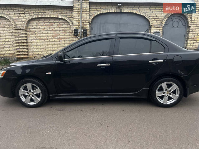 Черный Мицубиси Лансер, объемом двигателя 2 л и пробегом 192 тыс. км за 6300 $, фото 6 на Automoto.ua