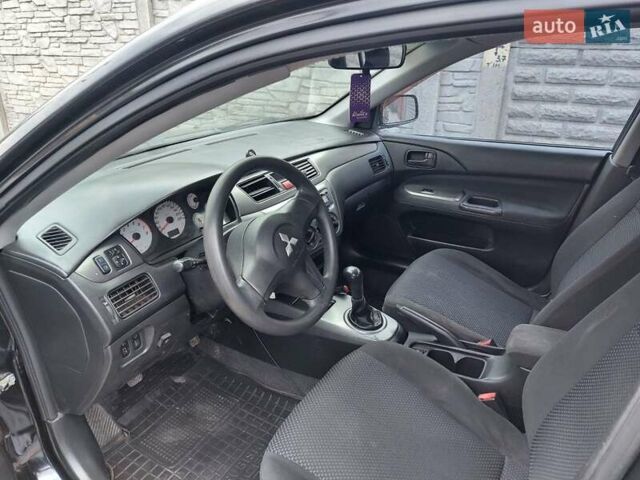 Чорний Міцубісі Lancer, об'ємом двигуна 1.6 л та пробігом 215 тис. км за 4900 $, фото 9 на Automoto.ua