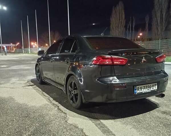 Черный Мицубиси Лансер, объемом двигателя 2 л и пробегом 240 тыс. км за 6400 $, фото 6 на Automoto.ua