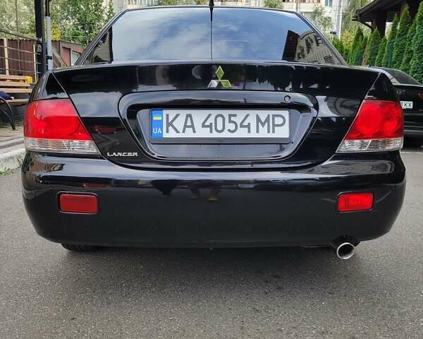 Чорний Міцубісі Lancer, об'ємом двигуна 1.58 л та пробігом 334 тис. км за 4750 $, фото 8 на Automoto.ua