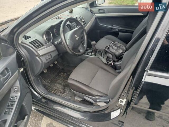 Черный Мицубиси Лансер, объемом двигателя 1.5 л и пробегом 253 тыс. км за 5500 $, фото 9 на Automoto.ua