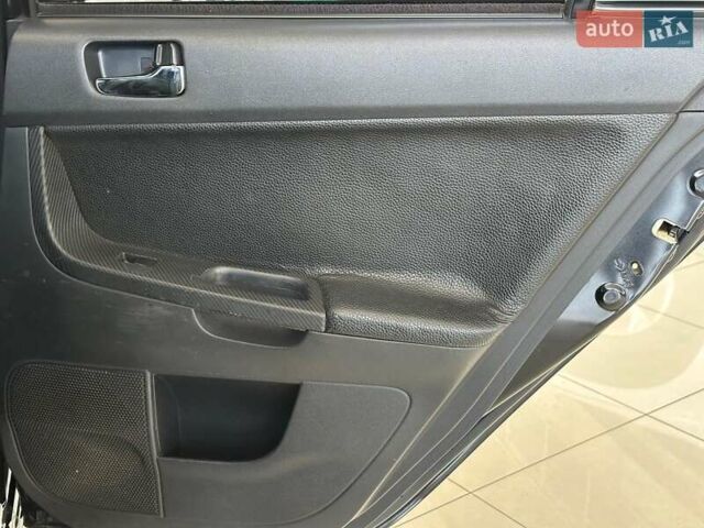 Чорний Міцубісі Lancer, об'ємом двигуна 2 л та пробігом 313 тис. км за 7690 $, фото 17 на Automoto.ua